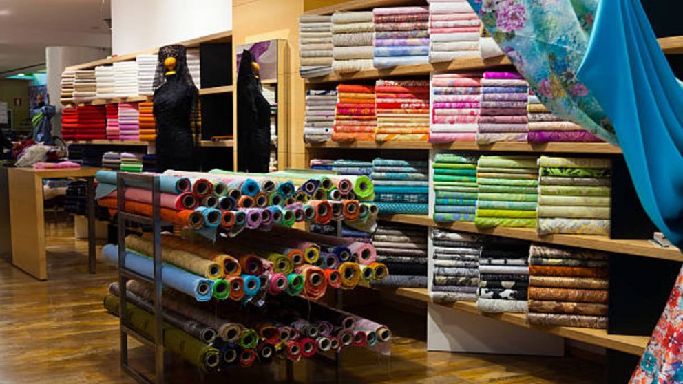 various textiles for sale in fabric shop