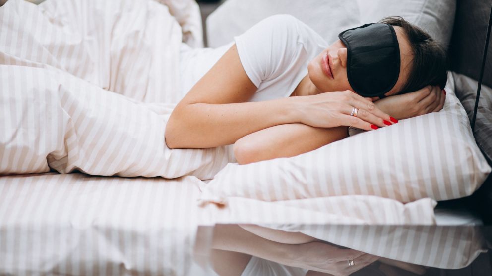 Young woman resting in bed in the morning