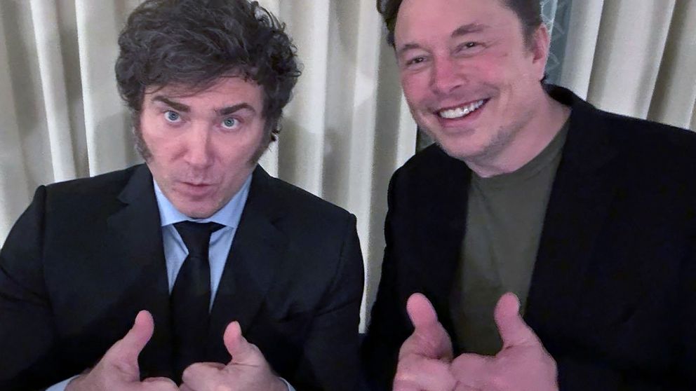 This handout picture released by the Argentinian Presidency shows Argentina's President Javier Milei (L) and SpaceX, Twitter and electric car maker Tesla CEO Elon Musk posing during a meeting while taking part in the Milken Institute's Global Conference i
