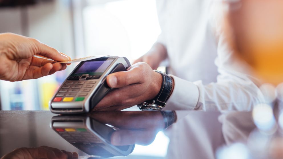 Customer using NFC technology for payment at bar