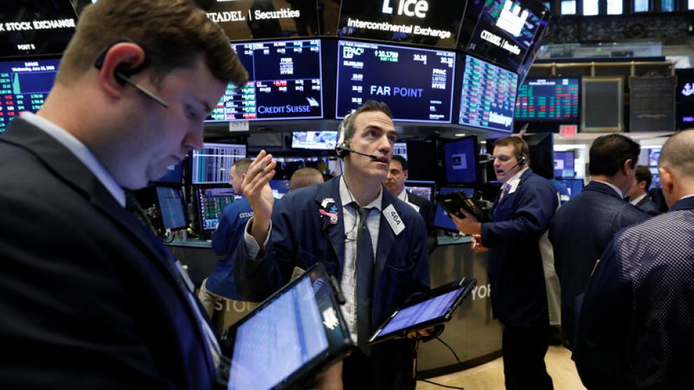 Traders work on the floor of the New York Stock Exchange (NYSE)