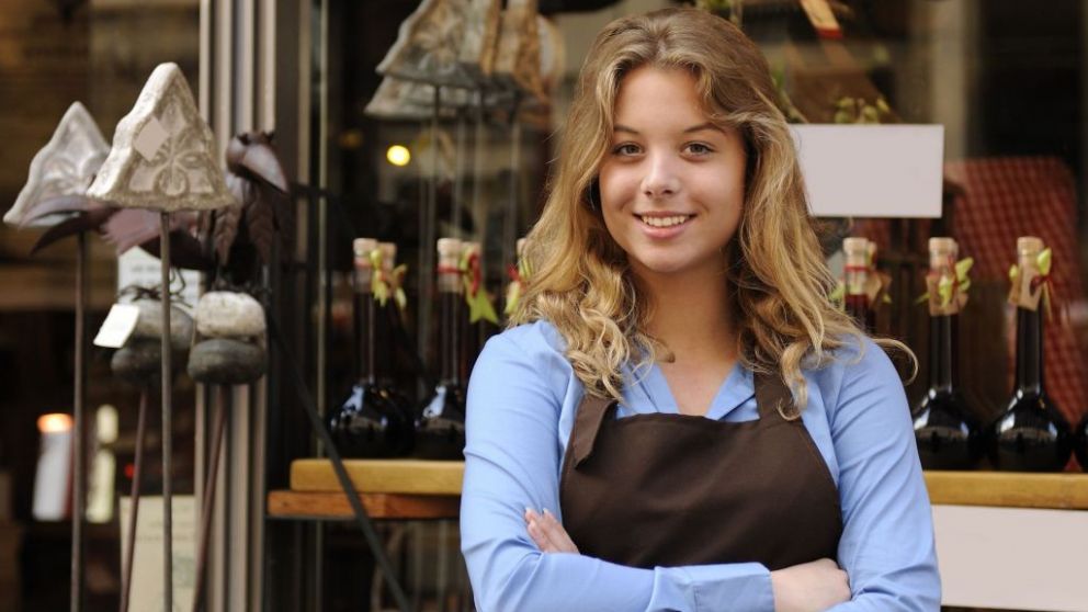 small business owner in front of store